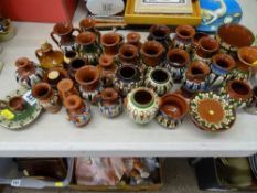 Collection of colourful slipware vessels etc