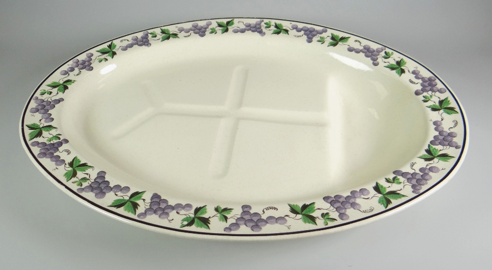 SWANSEA CREAMWARE MEAT PLATTER of oval form, decorated with a boarder of grape-vines, impressed mark