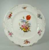 A NANTGARW PORCELAIN PLATE of alternate lobed form with moulding of scrolls, foliage and ribbons,