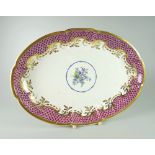 A SWANSEA PORCELAIN OVAL DISH of lobed form and decorated with purple scale border, foliate