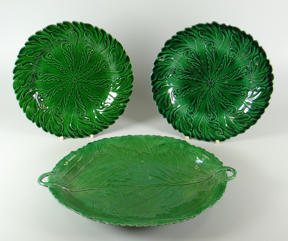 A SWANSEA POTTERY GREEN GLAZED LEAF-FORM DISH with twin loop handles, moulded vines and crimped rim,