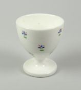 A SWANSEA PORCELAIN EGG CUP decorated with cornflower heads, Sidney Heath collection label to