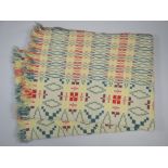 A WELSH BLANKET in geometric solid green, green flecked, yellow and red patterning, 205 x 145cms