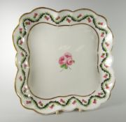 A NANTGARW PORCELAIN DISH of lobed square form and being border decorated in the Scottish style with