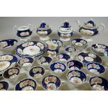 AN EXTENSIVE GAUDY WELSH TEAWARE SET in the Columbine pattern, 50+ pieces including teapots,