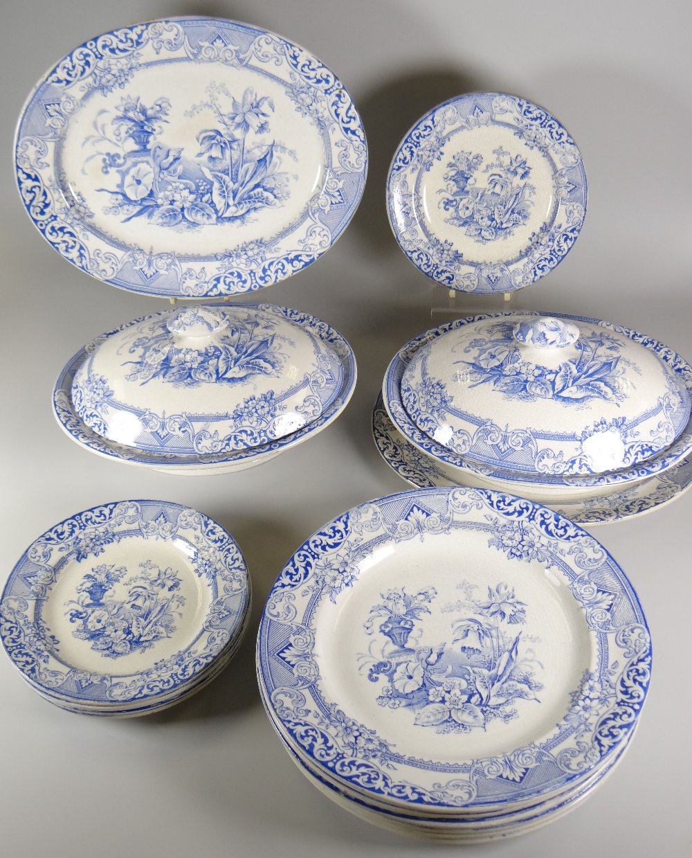 A LLANELLY PART DINNER-SET IN THE 'EASTERN' PATTERN in blue and white transfer, includes two tureens
