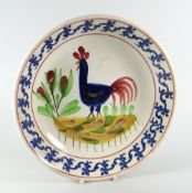 A LLANELLY POTTERY COCKEREL BOWL having a continuous blue foliate border, 26cms diam