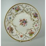 A FINE NANTGARW PORCELAIN PLATE London decorated, to the border with four wicker baskets overflowing