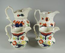 FOUR GAUDY WELSH JUGS including a pair