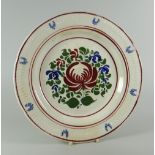 A SWANSEA DILLWYN PERIOD EARTHENWARE PLATE with raised fern and acanthus border, the interior enamel