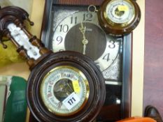 Two barometers and a modern pendulum wall clock