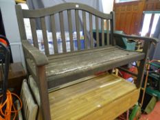 Wooden slatted garden bench with shaped back
