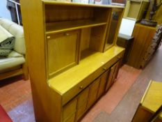 Mid Century Nathan lounge unit with single glazed door over three drawers, three base cupboards