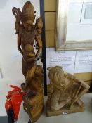 Two Eastern carved wooden figurines