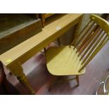Light wood table and three light wood stick back chairs