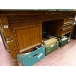 Oak? desk with single cupboard and three side drawers