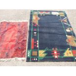Modern geometric pattern rug and a red tasselled rug