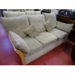 Light wood framed and upholstered three seater couch