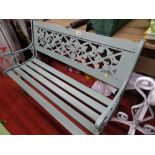 Painted wooden slatted garden bench with metal ends and floral decoration