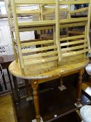 Small pine extending table and six light wood and woven seat chairs