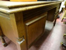Oak desk with three drawers and cupboard