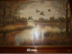 N GERO oil on board - ducks in flight across a river, 48 x 77 cms