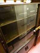 Three shelf polished wood glass fronted bookcase with lower two door cupboard