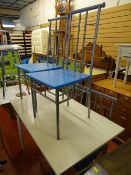 White painted table with metal decoration along with four metal and blue painted chairs