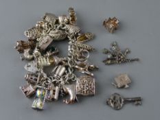 Silver charm bracelets with many charms, 3.8 troy ozs