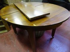 Oval polished wood and inlaid extending table