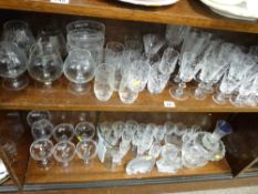 Large quantity of mainly drinking glassware (on two shelves) and paperweights
