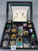Compartmented jewellery box with quantity of brooches etc and a box with earrings
