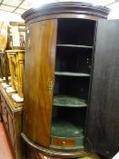 Polished wood corner cupboard with four interior shelves and two drawers