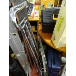 Pair of chrome extending guards, an overbed table, modern hard plastic suitcase, mobility walker and