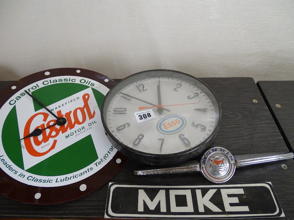 Castrol wall clock, Esso wall clock, Morris vehicle mascot and a Moke vehicle badge