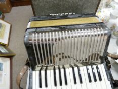 Cased Hohner of Germany twelve base accordion, retailed by Bell