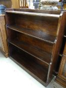 A pair of dark oak waterfall bookcases