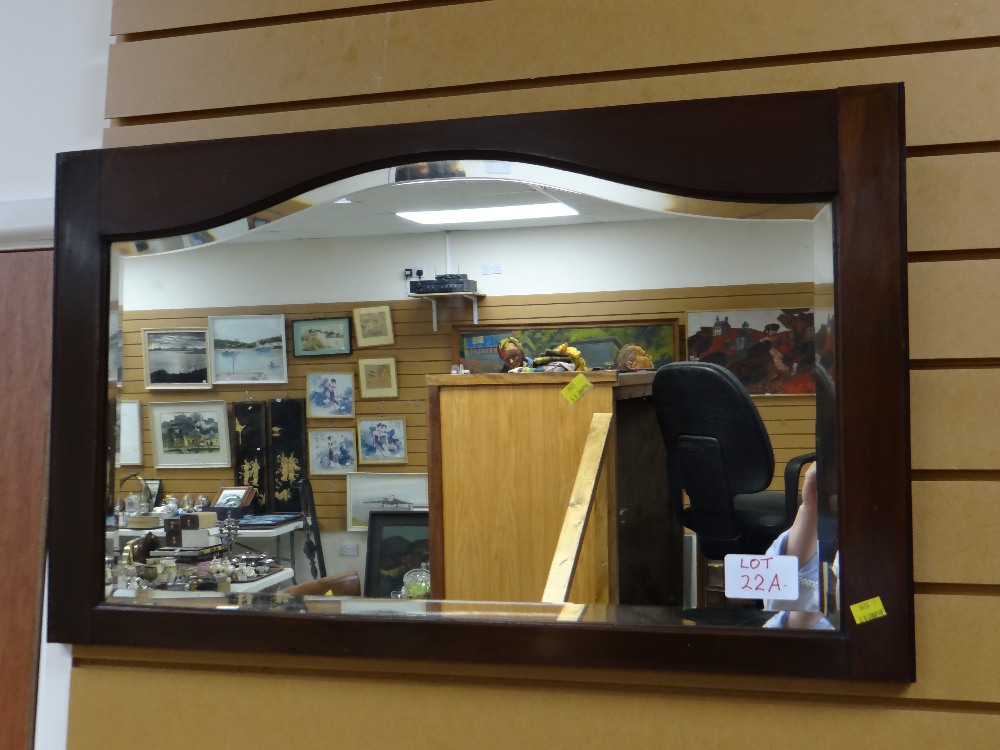 A vintage mahogany framed bevelled wall mirror