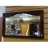 A vintage mahogany framed bevelled wall mirror