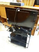 An LG flatscreen TV & stand E/T
