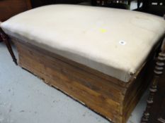 A large shaped pine upholstered seat top ottoman