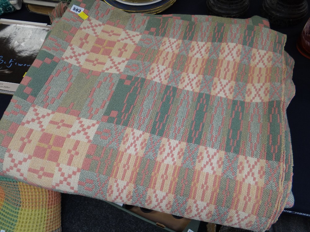 A Welsh blanket with pink & green geometric pattern