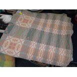 A Welsh blanket with pink & green geometric pattern