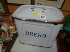 A vintage enamel bread bin