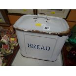 A vintage enamel bread bin