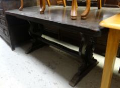 A dark wood refectory-style dining table