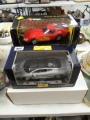 Four boxed model cars