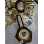 Three modern clocks & two barometers