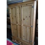 A good large pine two-drawer wardrobe with a three-drawer base