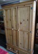 A good large pine two-drawer wardrobe with a three-drawer base